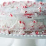 Horizontal image of a whole peppermint layer cake.