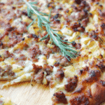 Flatbread made with your favorite pizza dough, shredded Mozzarella cheese, Italian sausage, apples and fresh rosemary.