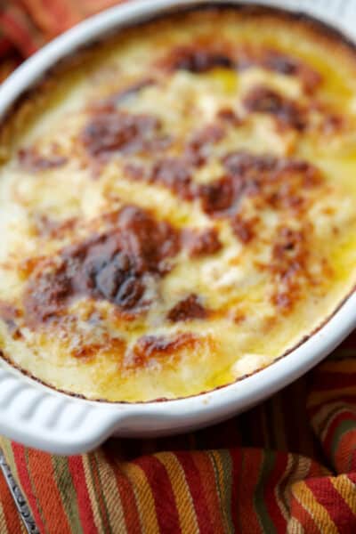 Scalloped potatoes are a classic side dish and this one made with layered fresh sweet potatoes is in a rich Havarti cream sauce.