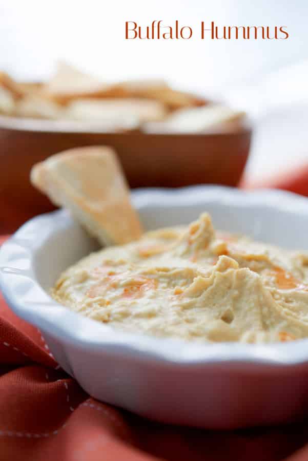 Buffalo Hummus in a white dish 