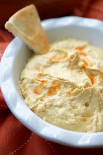 This Buffalo style hummus made with tabasco and crumbled bleu cheese is a quick, easy and deliciously spicy healthy snack. 