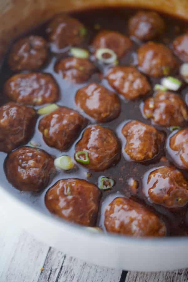 Asian Meatballs in a white Dutch oven