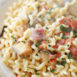 Fusilli Melanzana is a meatless pasta dish tossed with roasted eggplant, garlic, plum tomatoes, onions and fresh basil.