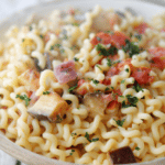 Fusilli Melanzana is a meatless pasta dish tossed with roasted eggplant, garlic, plum tomatoes, onions and fresh basil.