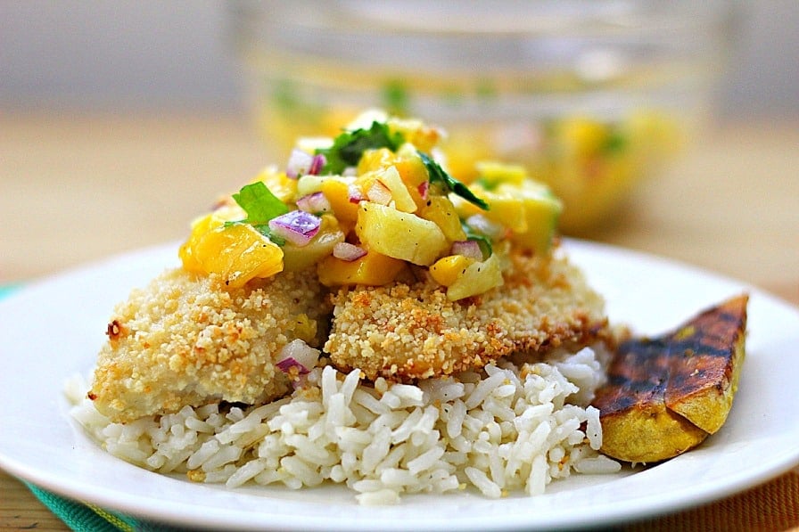 A plate of food with rice, with Tilapia and Macadamia