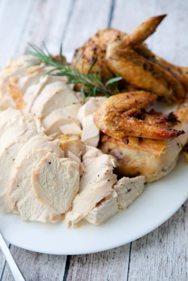 Carved Rosemary Lemon whole chicken on a plate