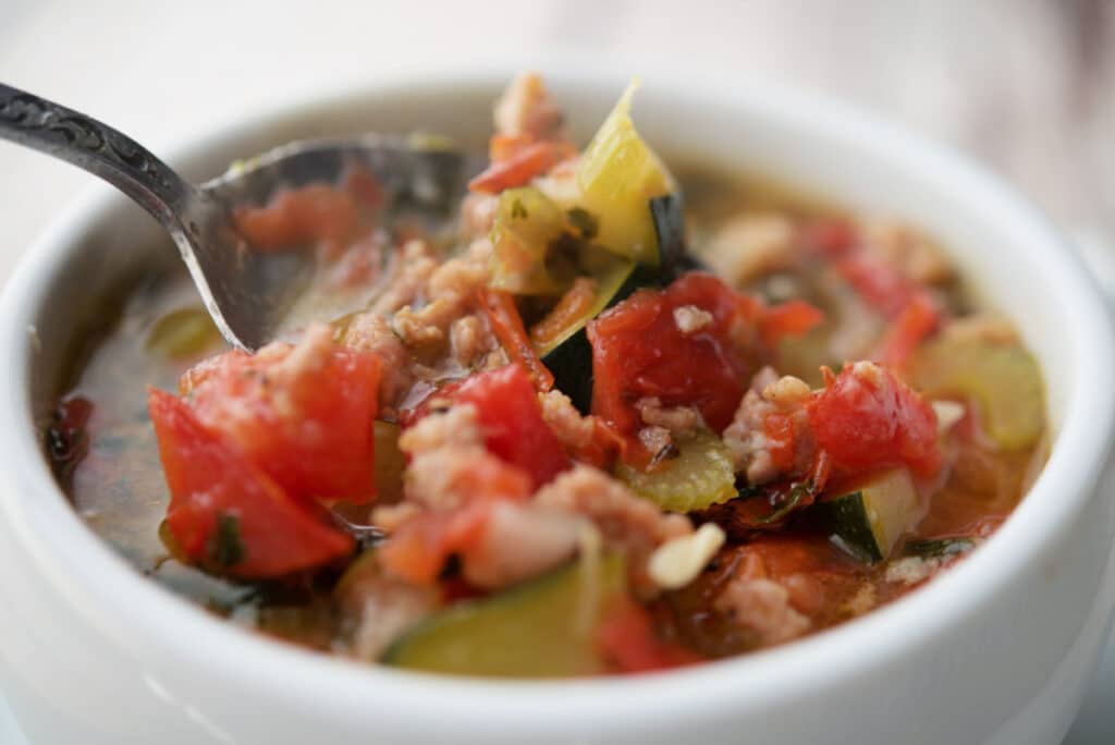 Sausage and Zucchini Soup on a spoon