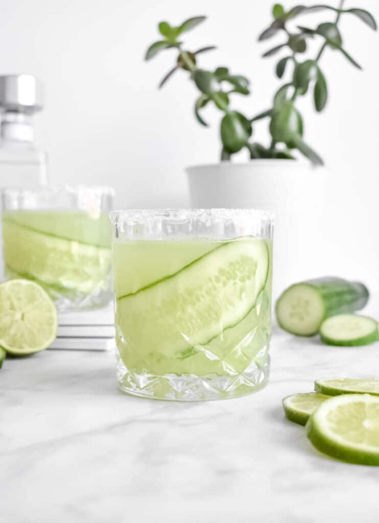 Close up of cucumber margarita in a glass. 