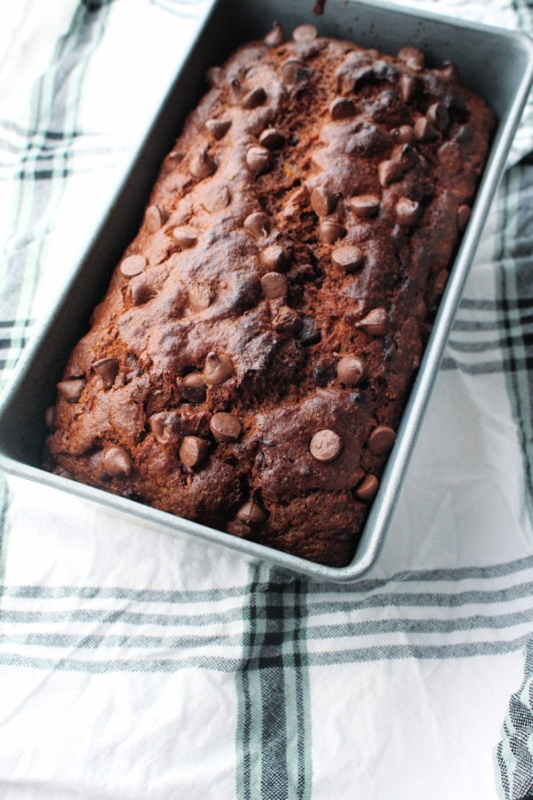 Double Chocolate Banana Bread in a loaf pan on a napkin
