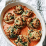 Mushrooms stuffed with sausage, spinach, ricotta, parmesan, romano, mozzarella cheese and Italian breadcrumbs over tomato cream sauce.