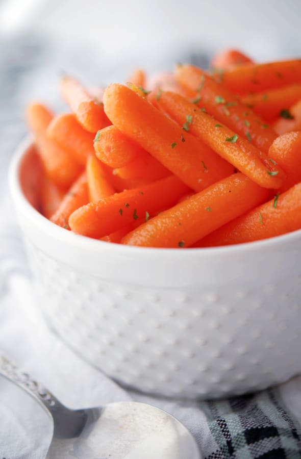 Honey Brown Sugar Carrots in a white serving bowl