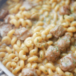 Closeup of balsamic sausage pasta in a skillet.