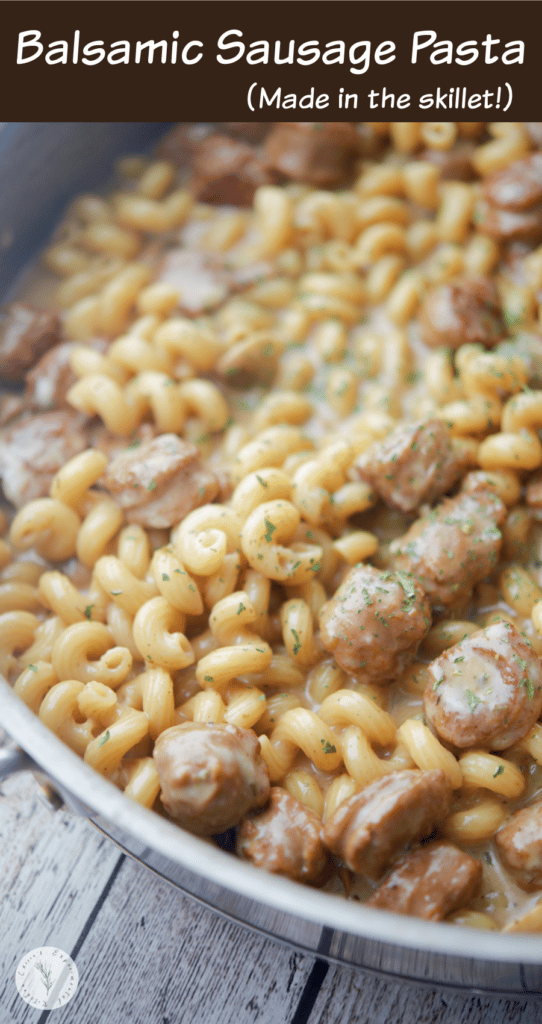 Closeup of balsamic sausage pasta in a skillet.