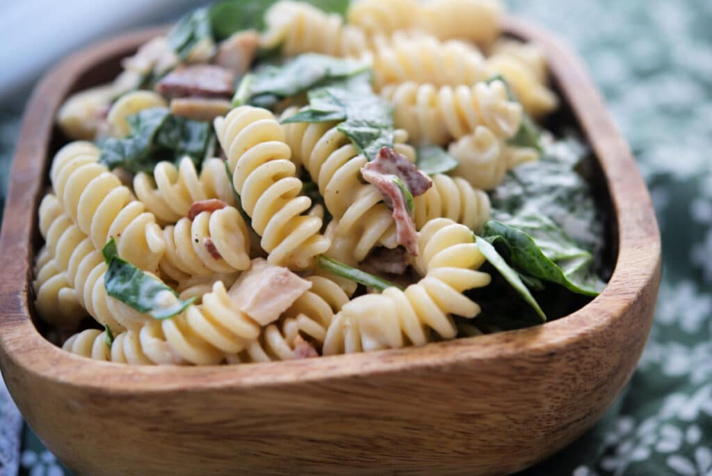 Bacon Ranch Pasta Salad in wooden bowl