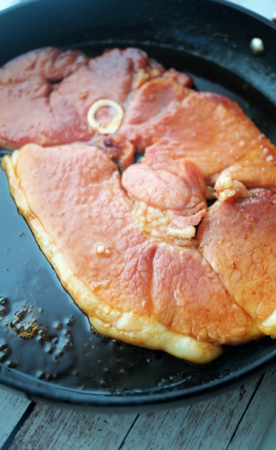 Honey Maple Ham Steak in a skillet