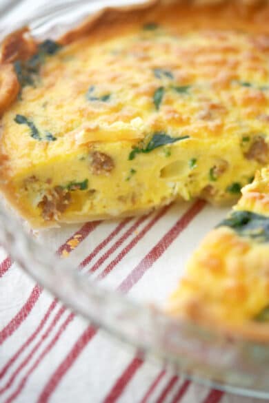 Savory Sausage and Spinach Quiche in a pie dish