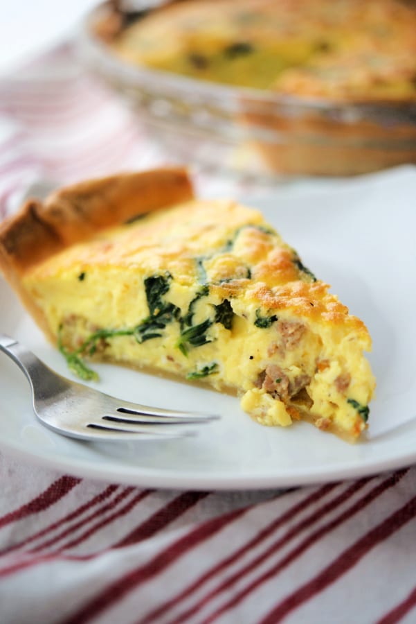 Sausage and Spinach Quiche on white plate