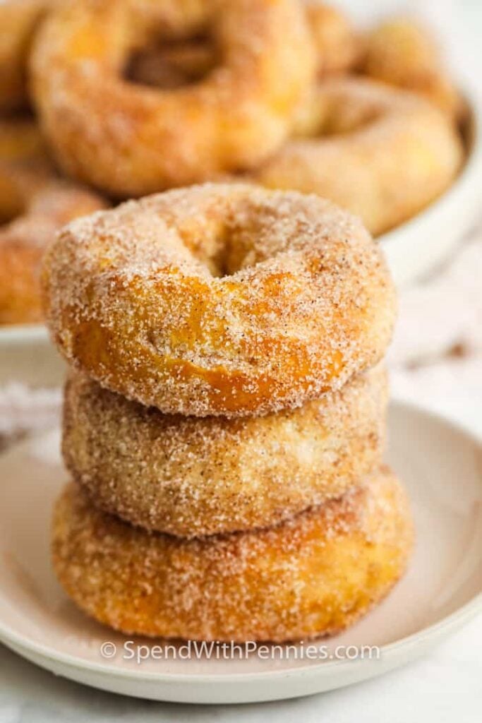 Stacked air fryer donuts on a plate. 