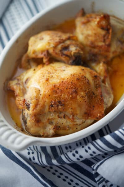 Cajun Chicken Thighs in a white dish.