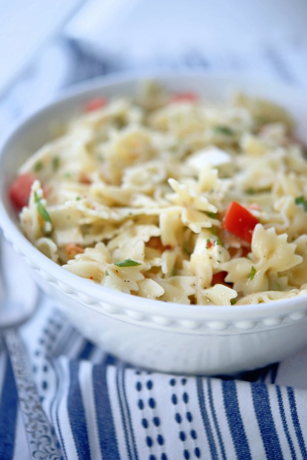 Caprese Pasta Salad in a bowl on a napkin.