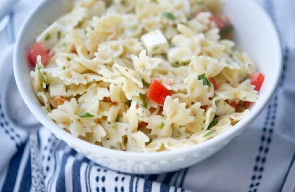 Caprese Pasta Salad in a white bowl. 