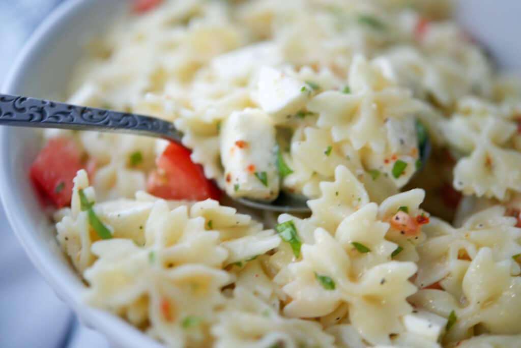 Caprese Pasta Salad on a spoon.