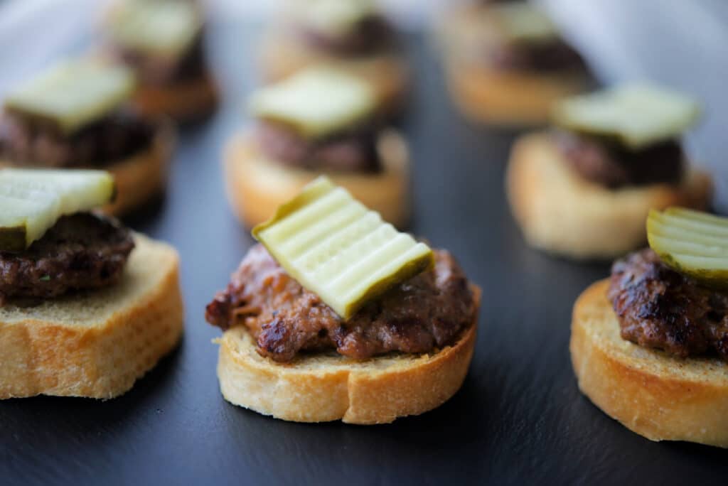 A few rows of cheeseburger crostini