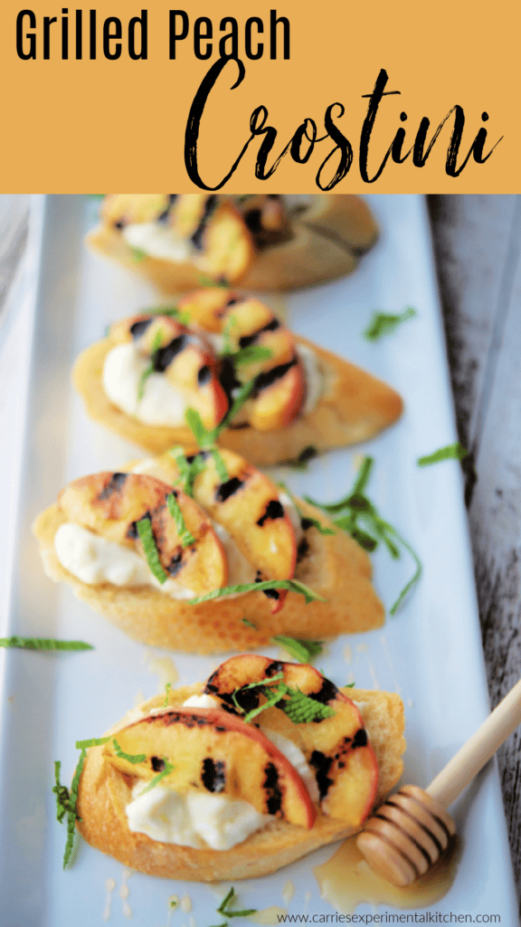 Grilled peaches on bread on a white platter