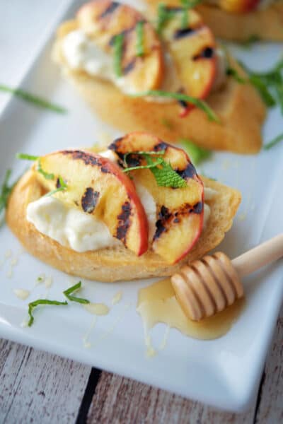 Grilled Peach Crostini on a white platter