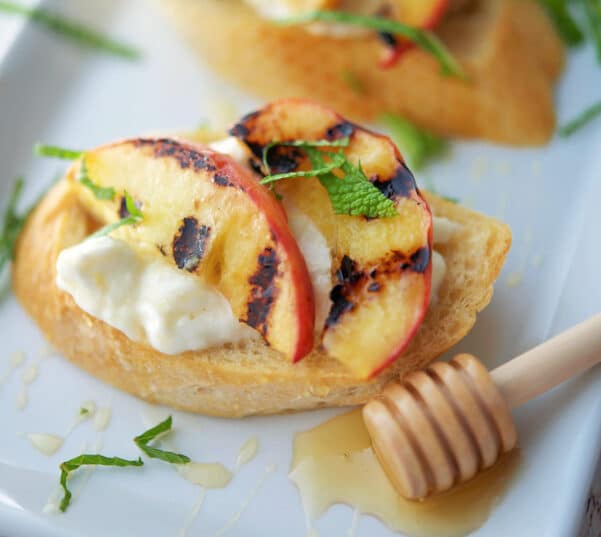 Grilled Peach Crostini on a white platter