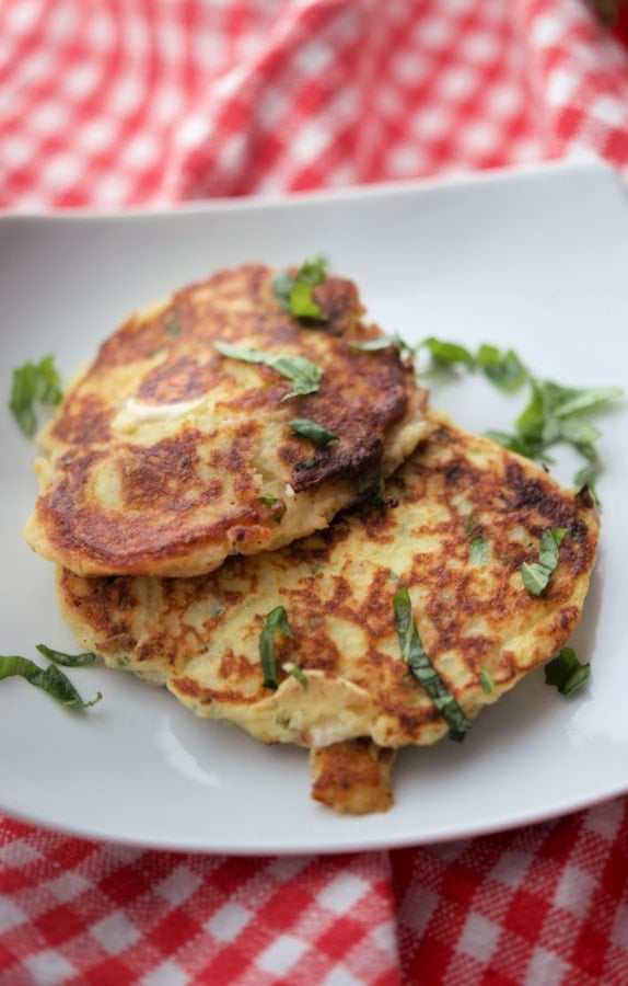 Mozzarella Basil Fritters on a white plate. 