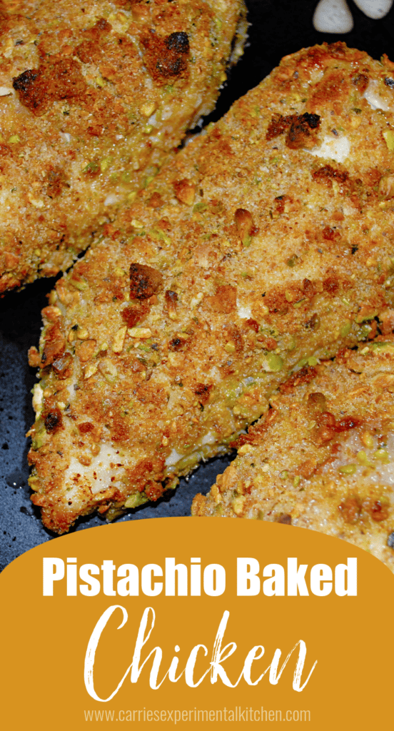 Chicken breasts on a plate with a pistachio breading.