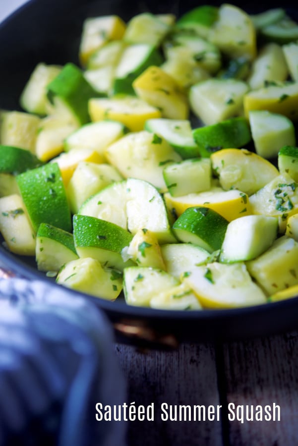 Squash and zucchini diced in a skillet. 