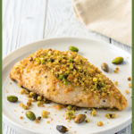 pistachio baked chicken breast on a plate