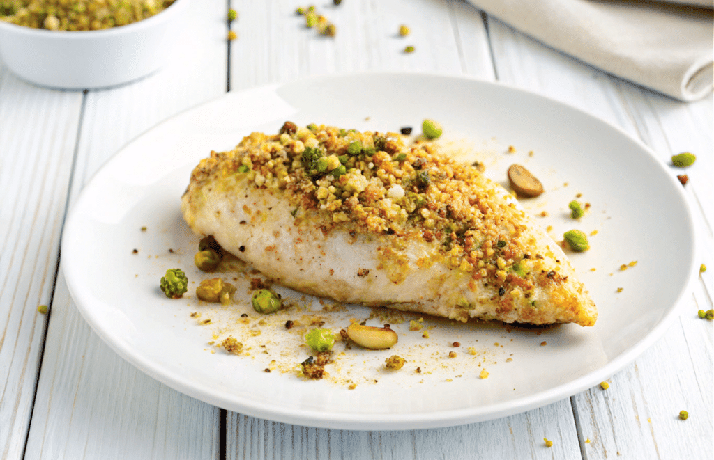 a close up of pistachio baked chicken