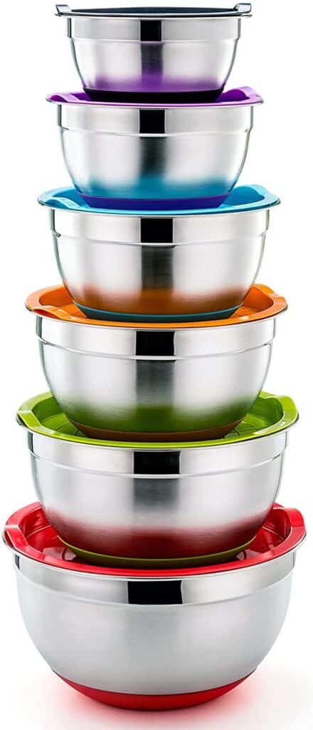 set of metal mixing bowls with colored lids