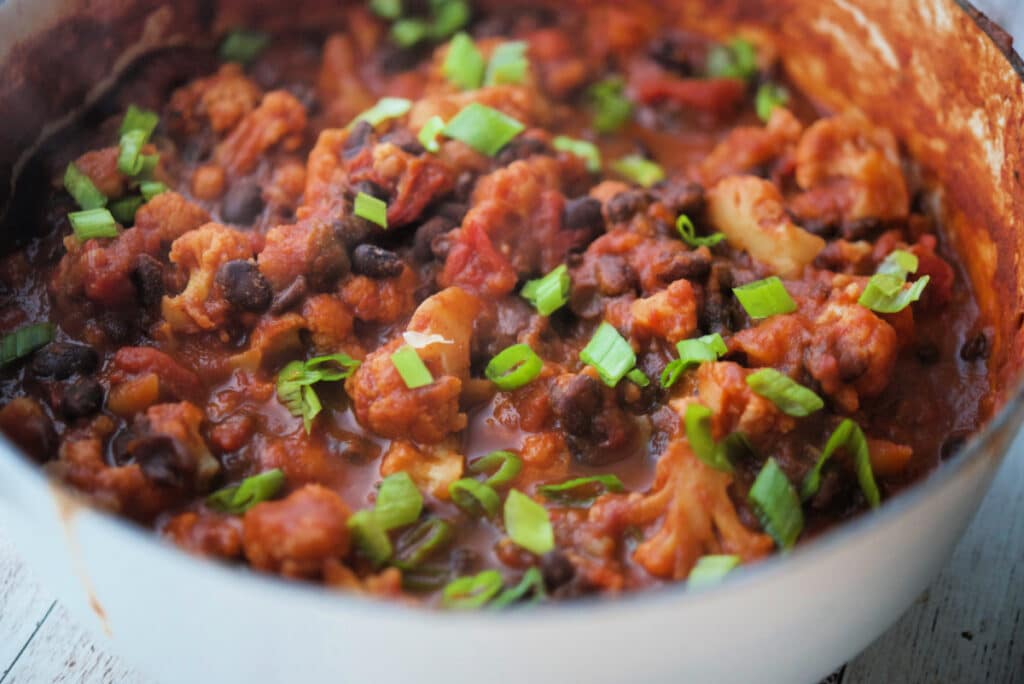 A close up of vegetarian chili with cauliflower