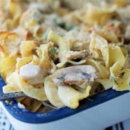 A close up of a chicken casserole on a spoon