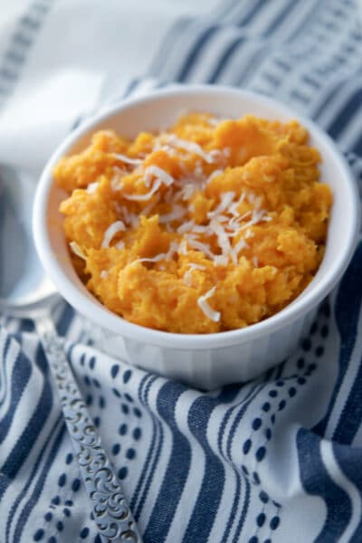 Overhead of coconut sweet potatoes in white bowl