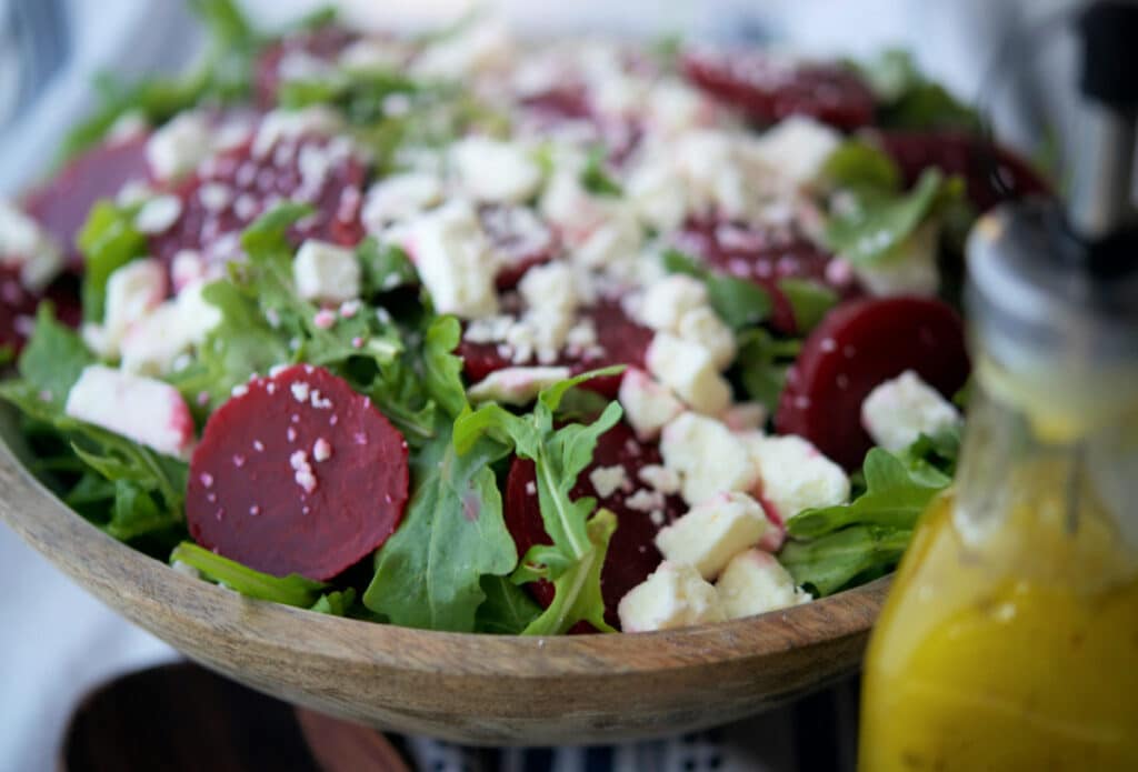 A close up of arugula salad with beets