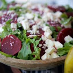 A close up of arugula salad with beets