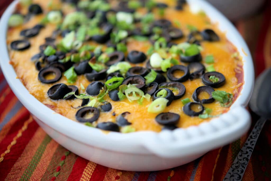 A close up of dip in a white dish