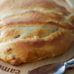 A close up of baked brie en croute