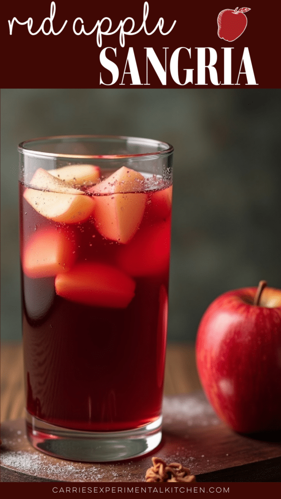a tall glass of red apple sangria