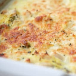 A close up of cooked spaghetti squash with chicken and broccoli