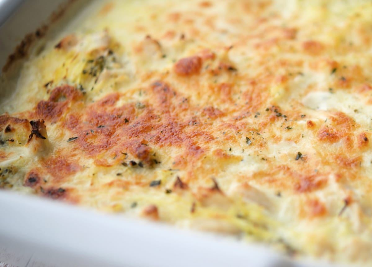 A close up of cooked spaghetti squash with chicken and broccoli