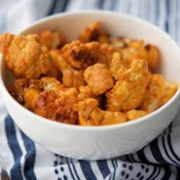 A close up of a bowl of Buffalo cauliflower