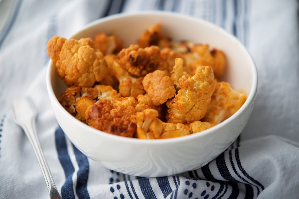 A close up of a bowl of Buffalo cauliflower