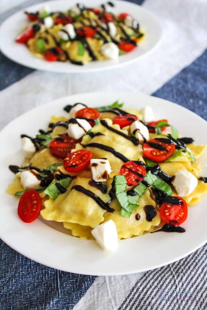 Caprese ravioli on a white plate