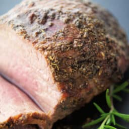 a close up of italian herbs on a roast